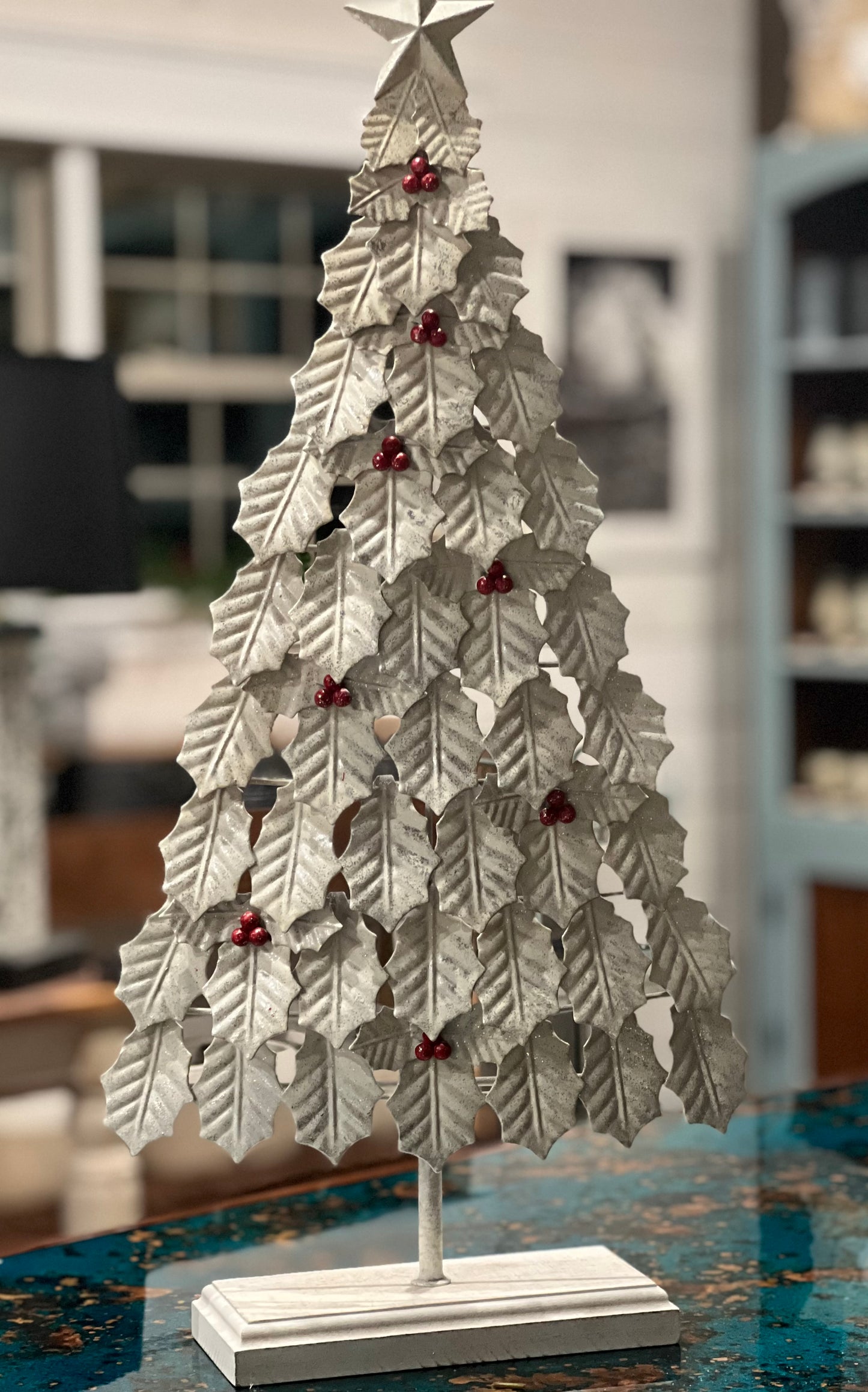 Rustic white holly leaf tree with red berries and star. Beautiful addition for your farmhouse Christmas.