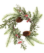 The Sugar Berry Pine Candle Ring brings a touch of festive color to any display. It includes sprigs of short needle pine greenery blended with mistletoe, icy red berries, and pinecones. 