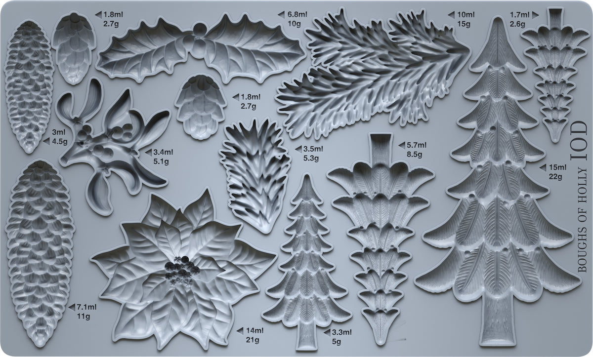 Mould packed with Evergreen  tree castings, beautiful poinsettia blossom, and pine-needle boughs.