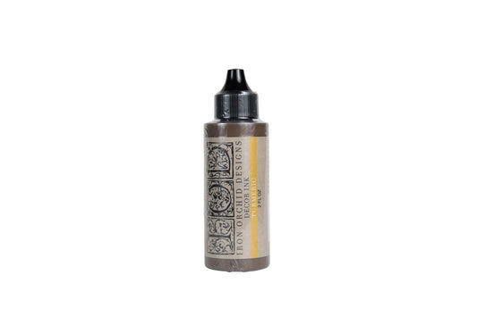 A 2oz bottle of Ink by Iron Orchid Design in Tumeric.