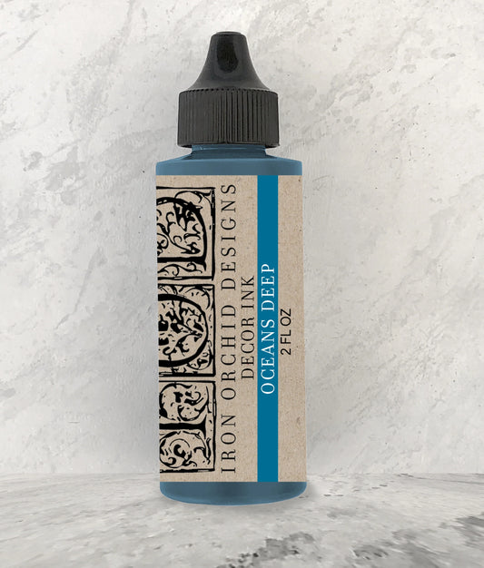 A 2oz bottle of Iron Orchid Designs decor ink in Ocean’s Deep.