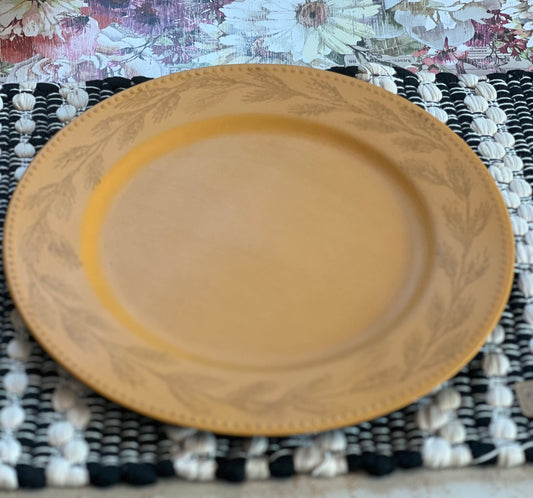 Golden yellow charger with wheat  pattern.