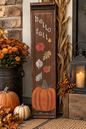 Reclaimed cabinet panel made into a hello fall sign. Pumpkin with falling leaes.