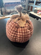 A small decorative fabric country plaid pumpkin in assorted colors topped with a rustic burlap stem and bow. 