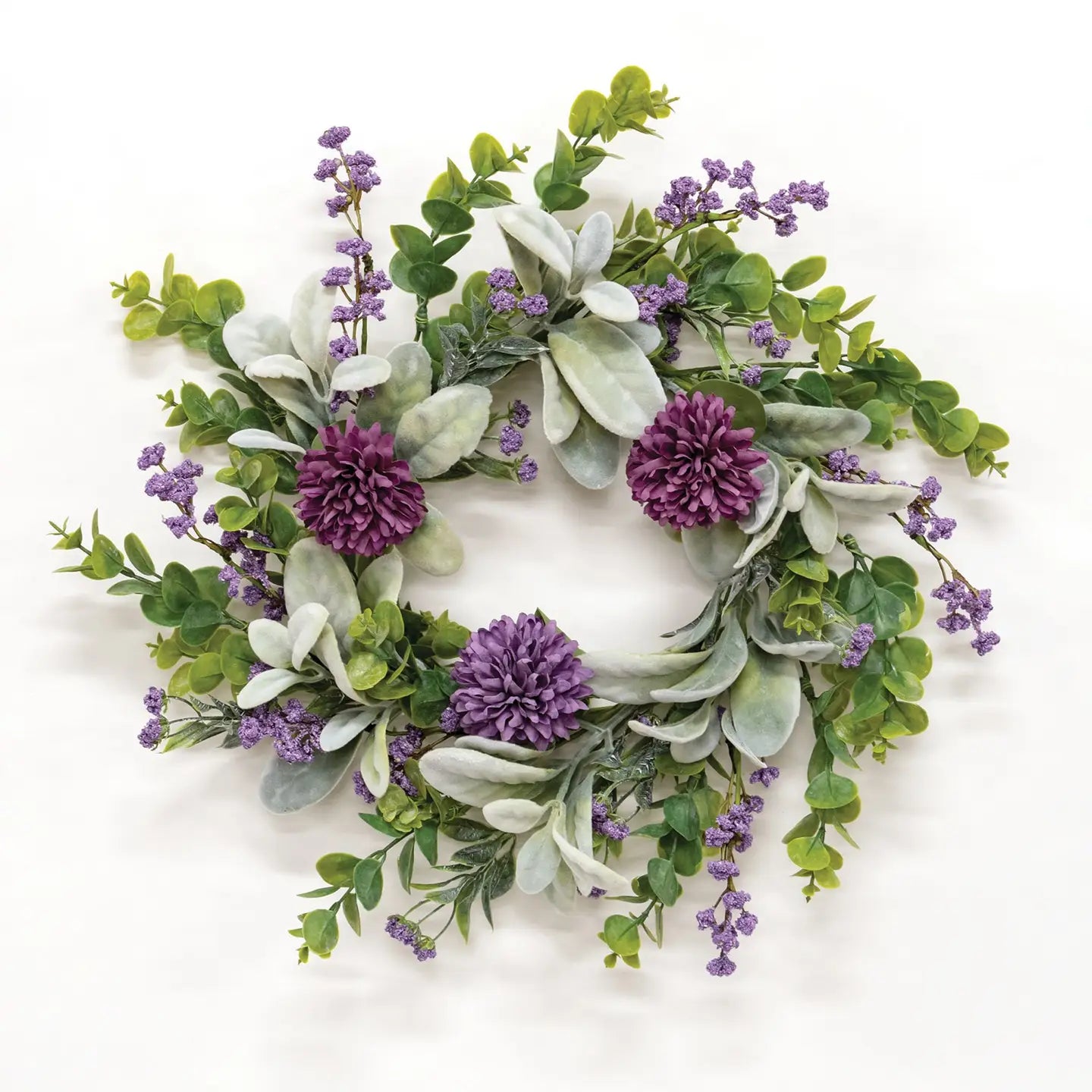 A floral wreath with violet chrysanthemums and lamb's ear foliage, designed for large candle rings.