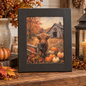 Handcrafted autumn picture featuring a highland cow and pumpkins in front of an old barn.