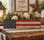 Rustic wood with an aged finish highlights this American Flag Centerpiece Box. Handcrafted by Timber & Grace.