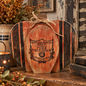Full of warm, vintage farmhouse character, this handcrafted wood pumpkin features a layered design with rich autumn tones, bold striped accents and a distressed finish.