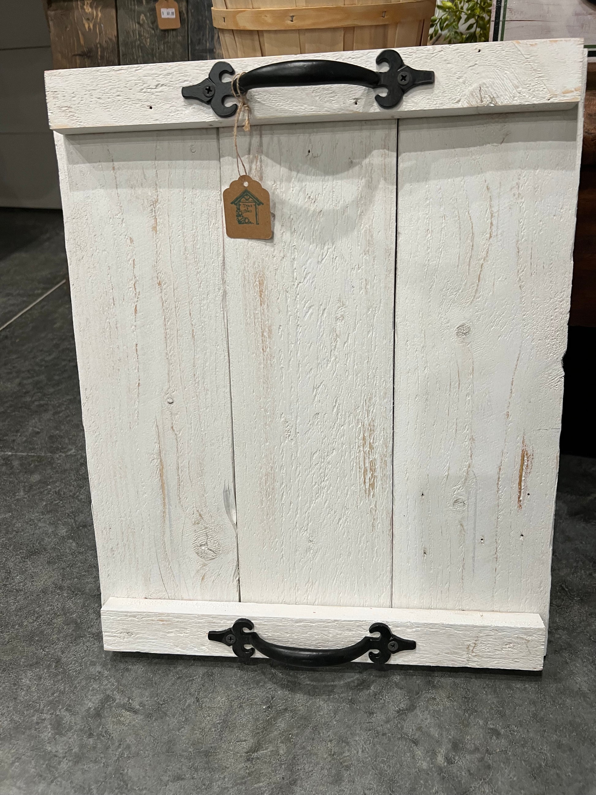Rustic wood tray whitewashed with black iron handles makes the perfect addition to your farmhouse.